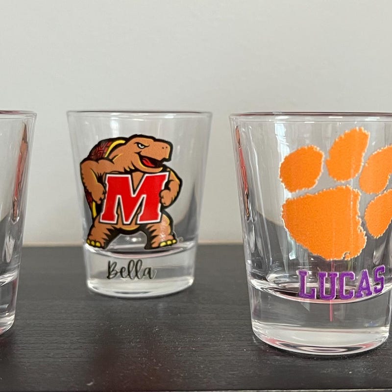 Personalized college shot glass. Custom shot glasses. Customized with college logo/mascot & name. College merch. All colleges available!